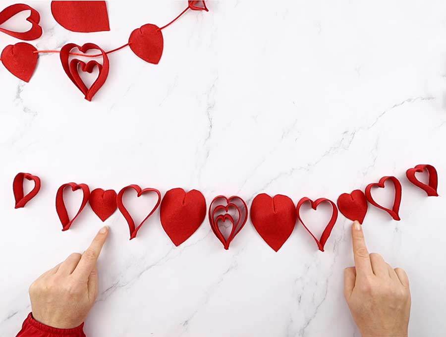 arranging the heart shaped decorations