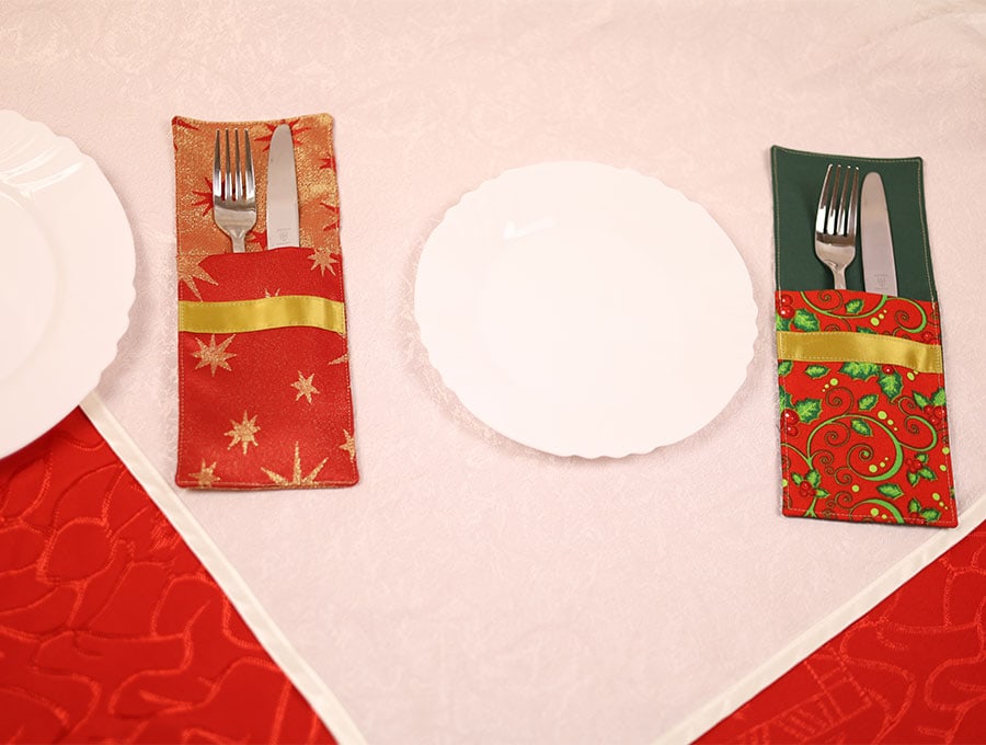 christmas cutlery holders set on a table
