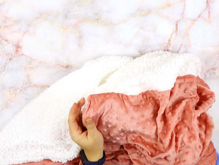 turn around the diy swaddle blanket and push out the corners