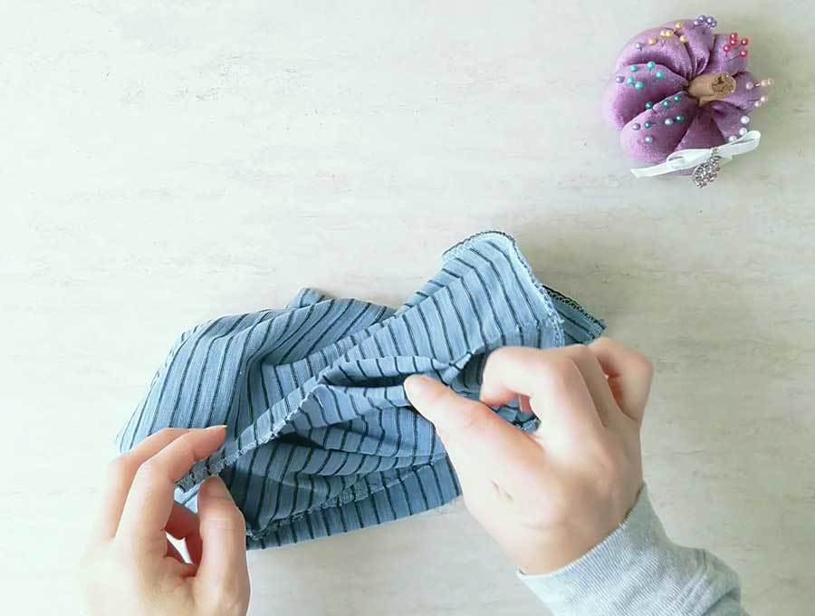 turning around the slouchy beanie hat through the opening on the side