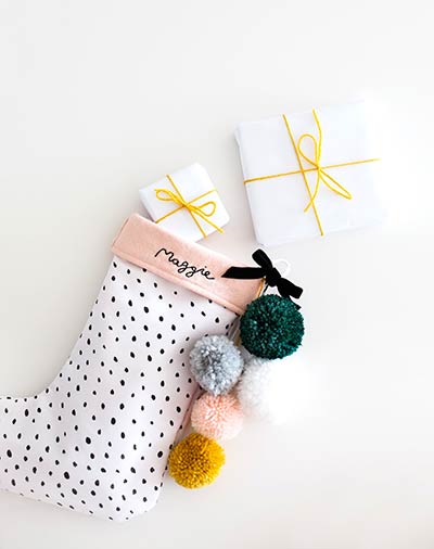 diy christmas stocking with embroidered name and pom poms