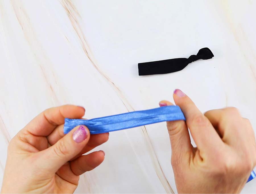 folding elastic in half to make elastic hair tie