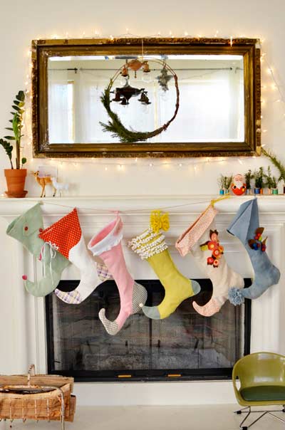 felt elf Christmas stockings on the mantel