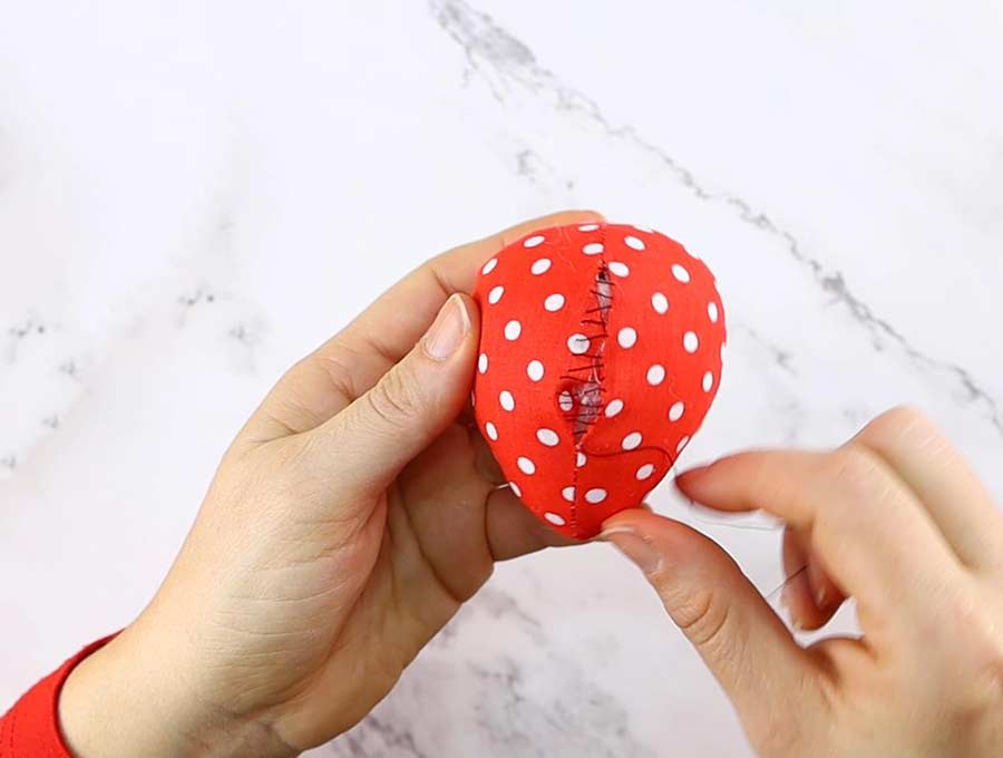 sewing egg using the ladder stitch