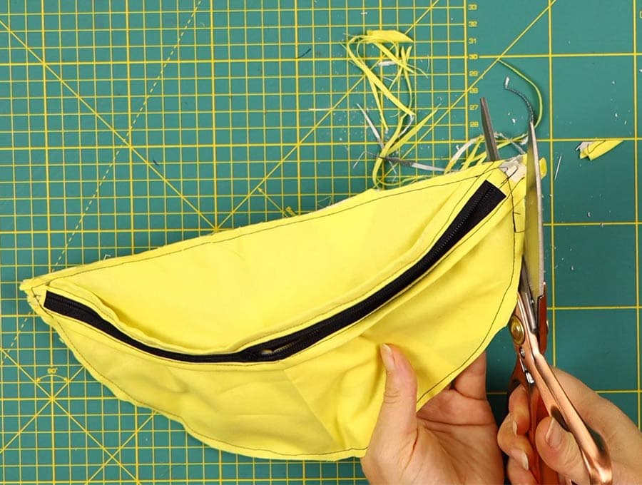 trimming the excess seam allowance on the diy hip bag