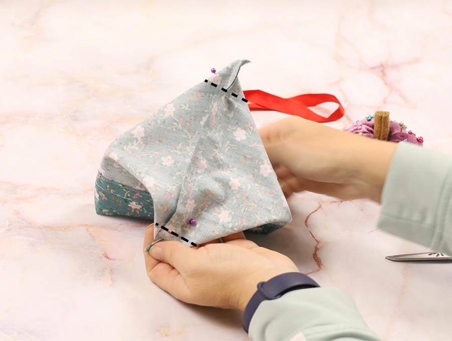 sew across the corners of the fabric gift bag