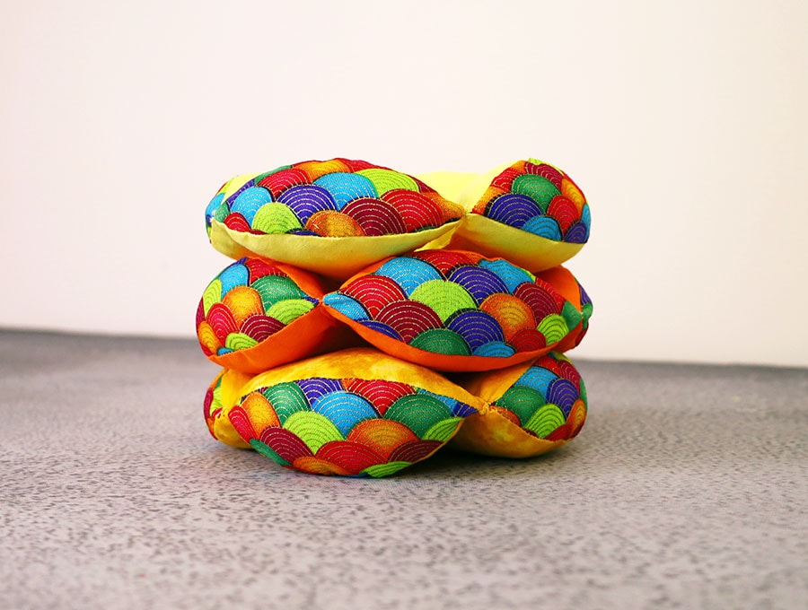 handmade montessori puzzle ball with pieces stacked