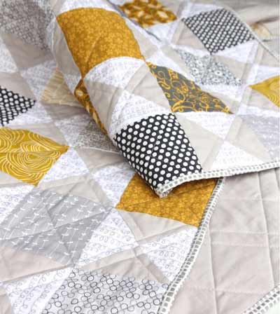 Hourglass quilt in grey and mustard