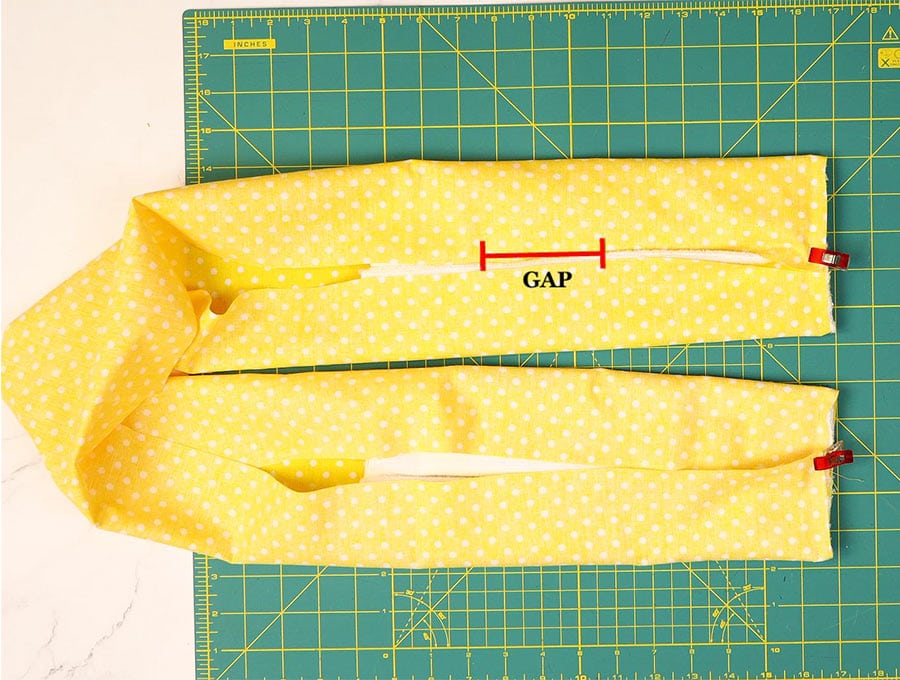 leaving a gap along the length of the kitchen towel scarf 