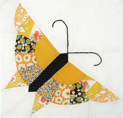 Pieced butterfly quilt block and butterfly patchwork quilt