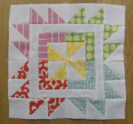 Pinwheel within a start quilt block