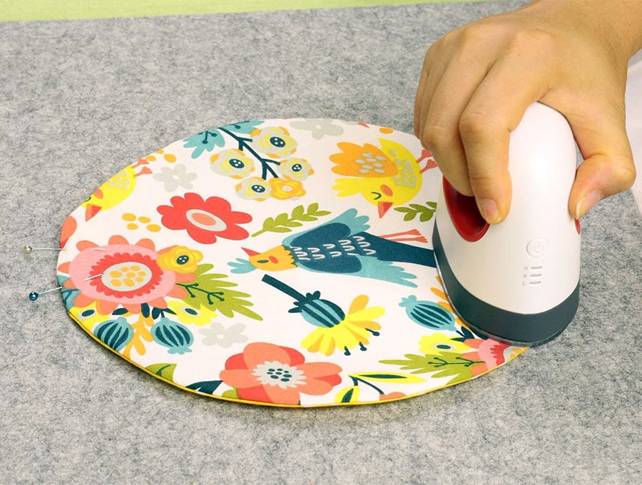 turning right side out and pressing the round fabric trinket tray
