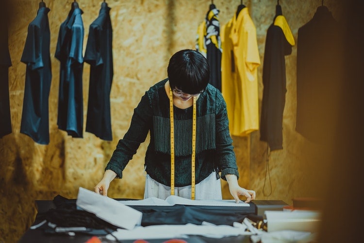 Seamstress sewing a garment