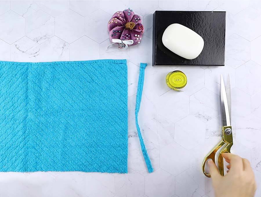 removing hemmed side of washcloth to make soap saver