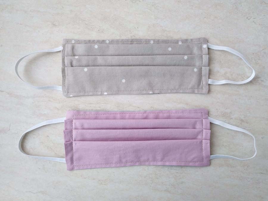 two surgical masks side by side