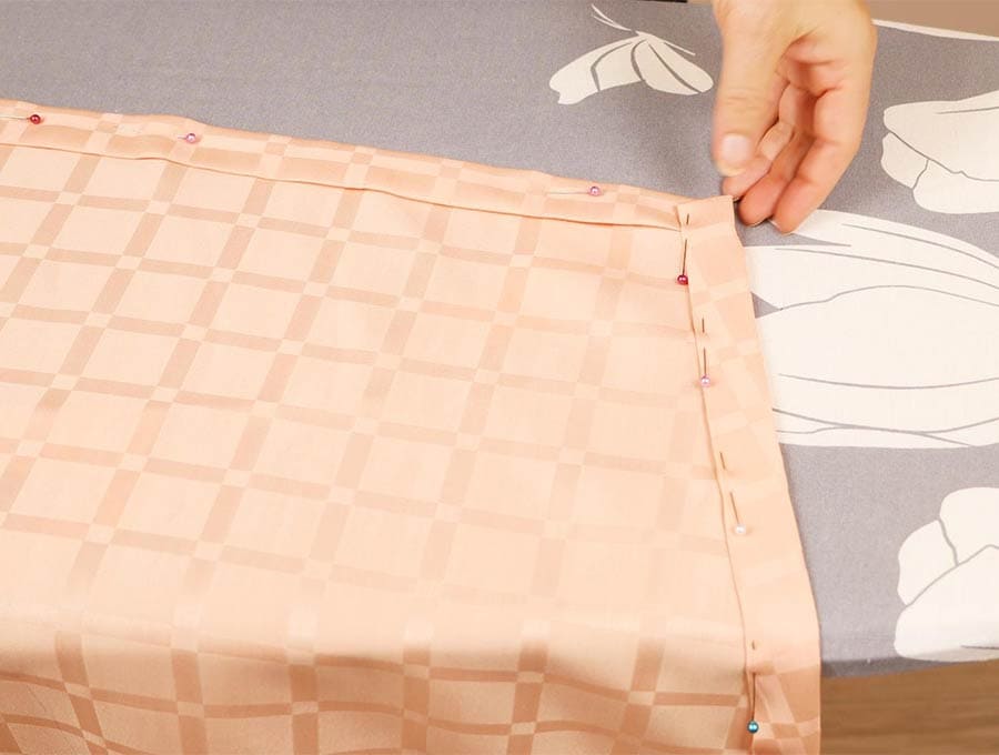 hem of the diy tablecloth all pinned