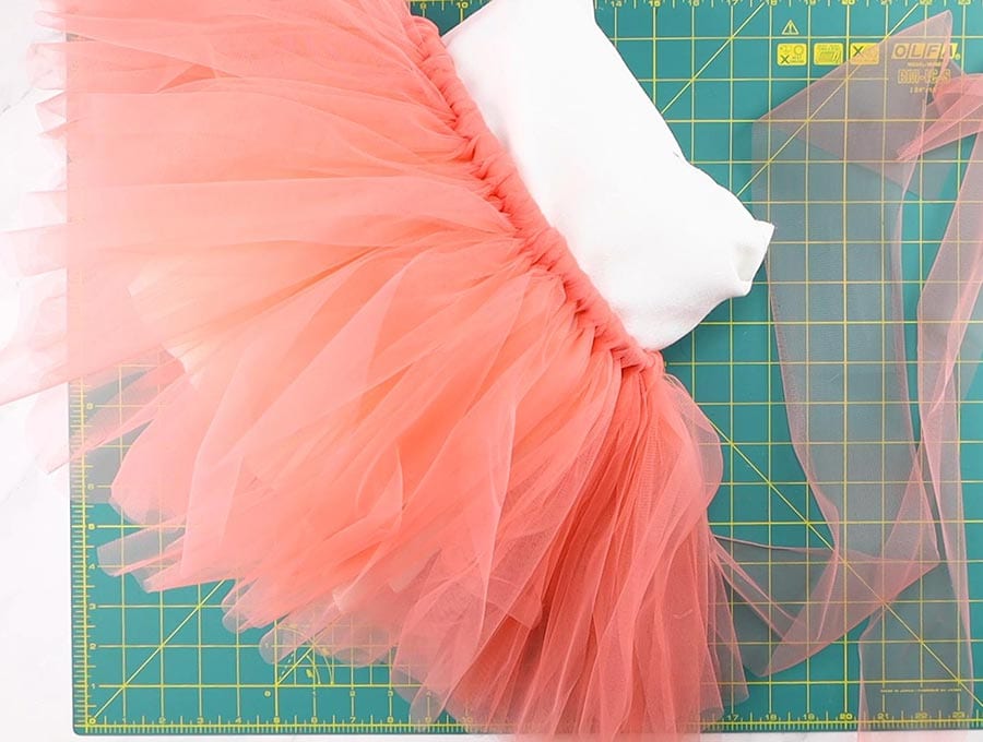 making of the tutu skirt - knotting the tulle strips on the elastic waist